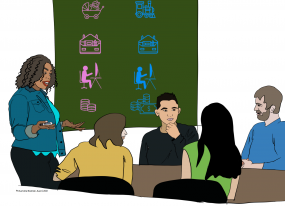 Une formatrice discute des stéréotypes de genre avec des adultes apprenants